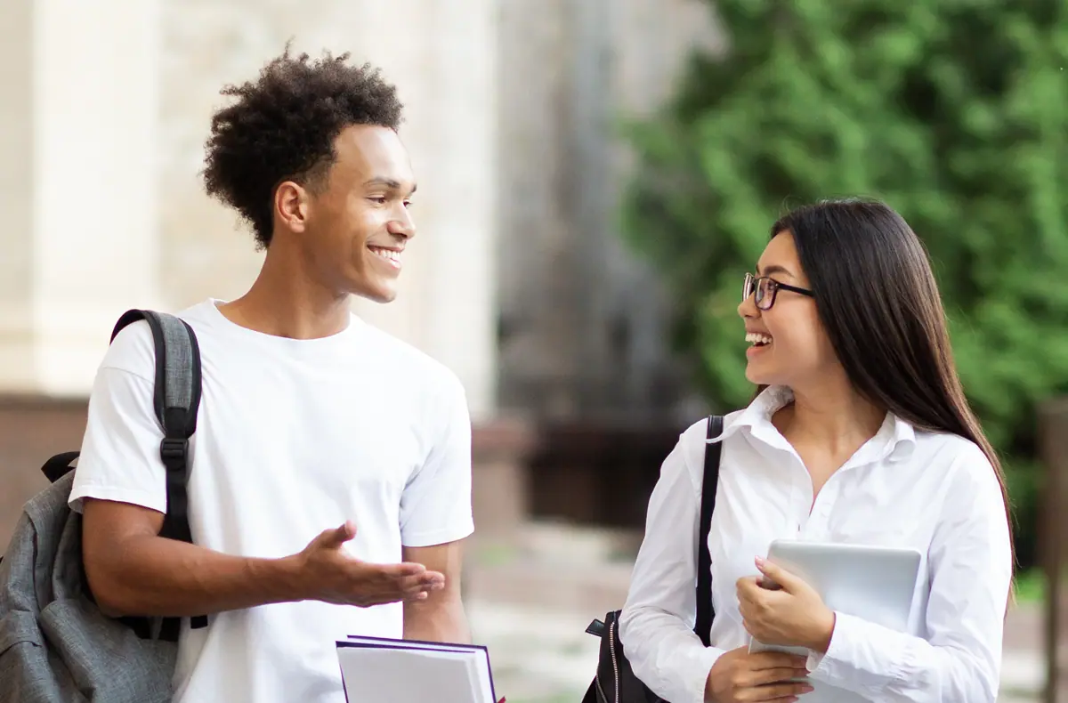 college students talking on campus.