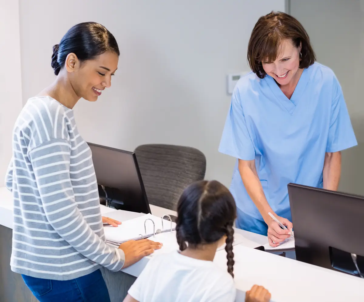 Nurse confidently conversing with patient in their native language.